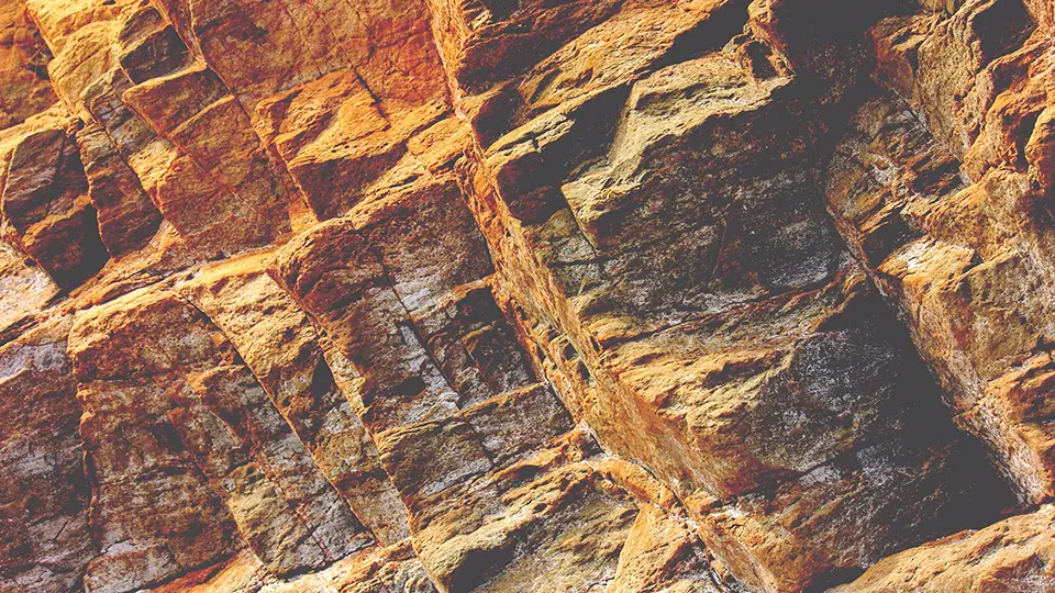 A close-up view of a rock formation showing detailed layers and textures.