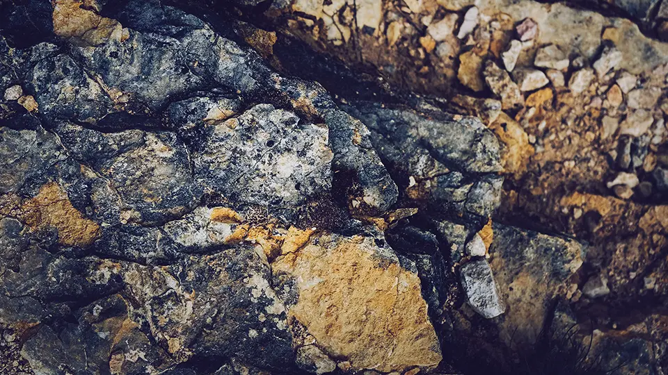 A close-up view of a rock formation showing detailed layers and textures.